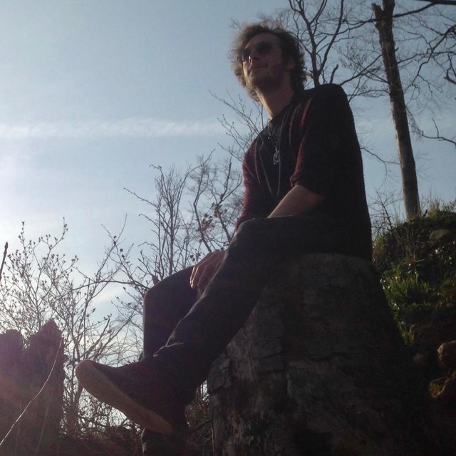 Kyryl Schwarz sitting outdoors in the sunlight